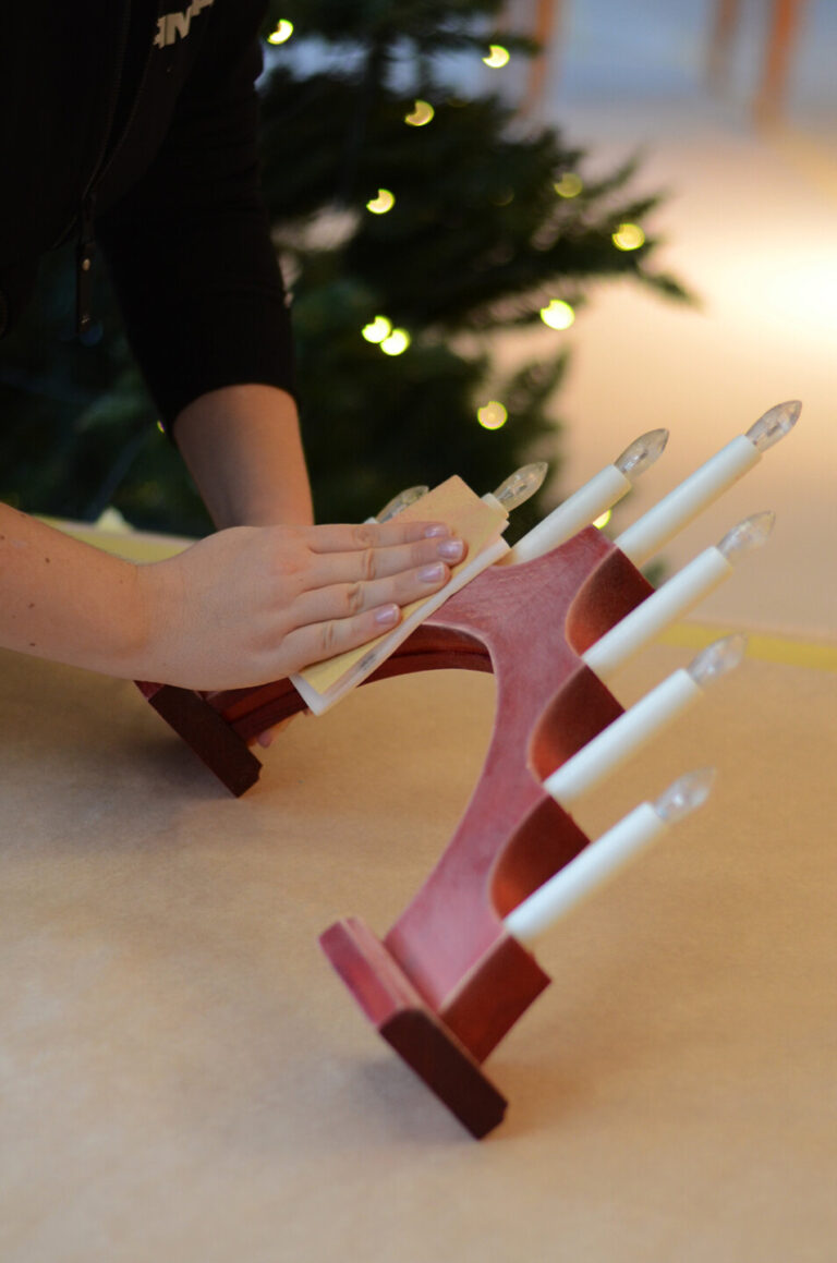 Sanding the candelabra