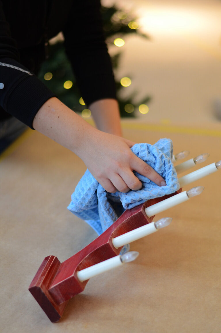 Wipe away the sanding dust using a microfiber cloth.