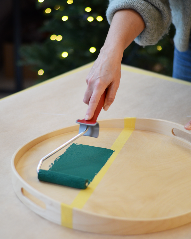 Rolling on paint with a mini felt roller