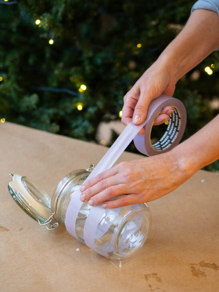 Mask the glass jar to create your pattern